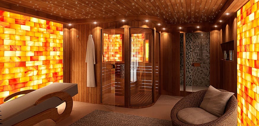 Phòng xông hơi khô sauna với nội thất gỗ thông, ánh sáng dịu nhẹ và đá sưởi, tạo không gian thư giãn. Phòng xông hơi khô sauna với nội thất gỗ thông, ánh sáng dịu nhẹ và đá sưởi, tạo không gian thư giãn.