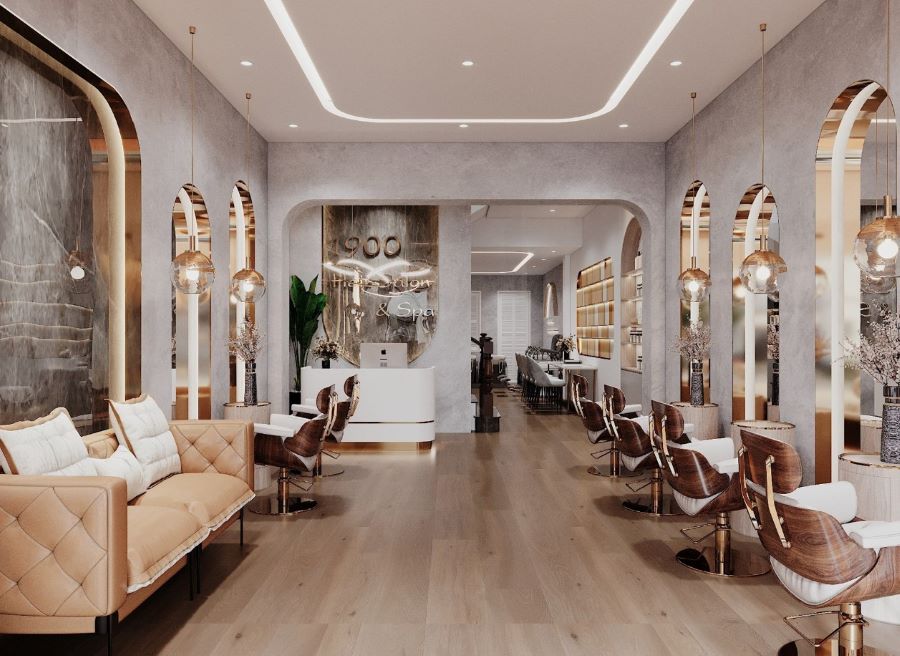 Mẫu salon tóc diện tích trên 100m2, thiết kế tinh tế với ghế da, bàn gỗ và đèn chùm trang trí